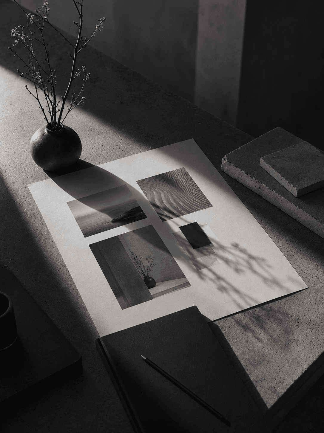 Studio process, a designer reviewing layout proofs on a light table